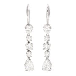 Tiffany & Co pair of platinum pear cut and round brilliant cut diamond pendant earrings, s...