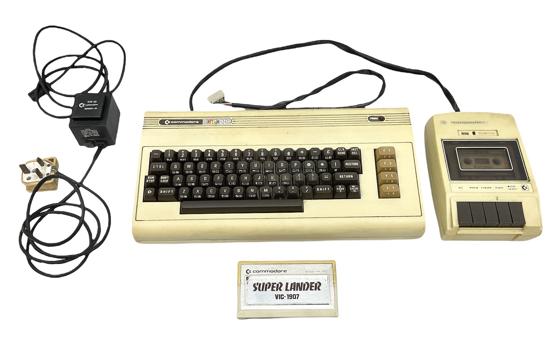 Commodore Vic 20 colour computer with power supply together with Commodore Datassette and Super Lander VIC 1907 game cassette