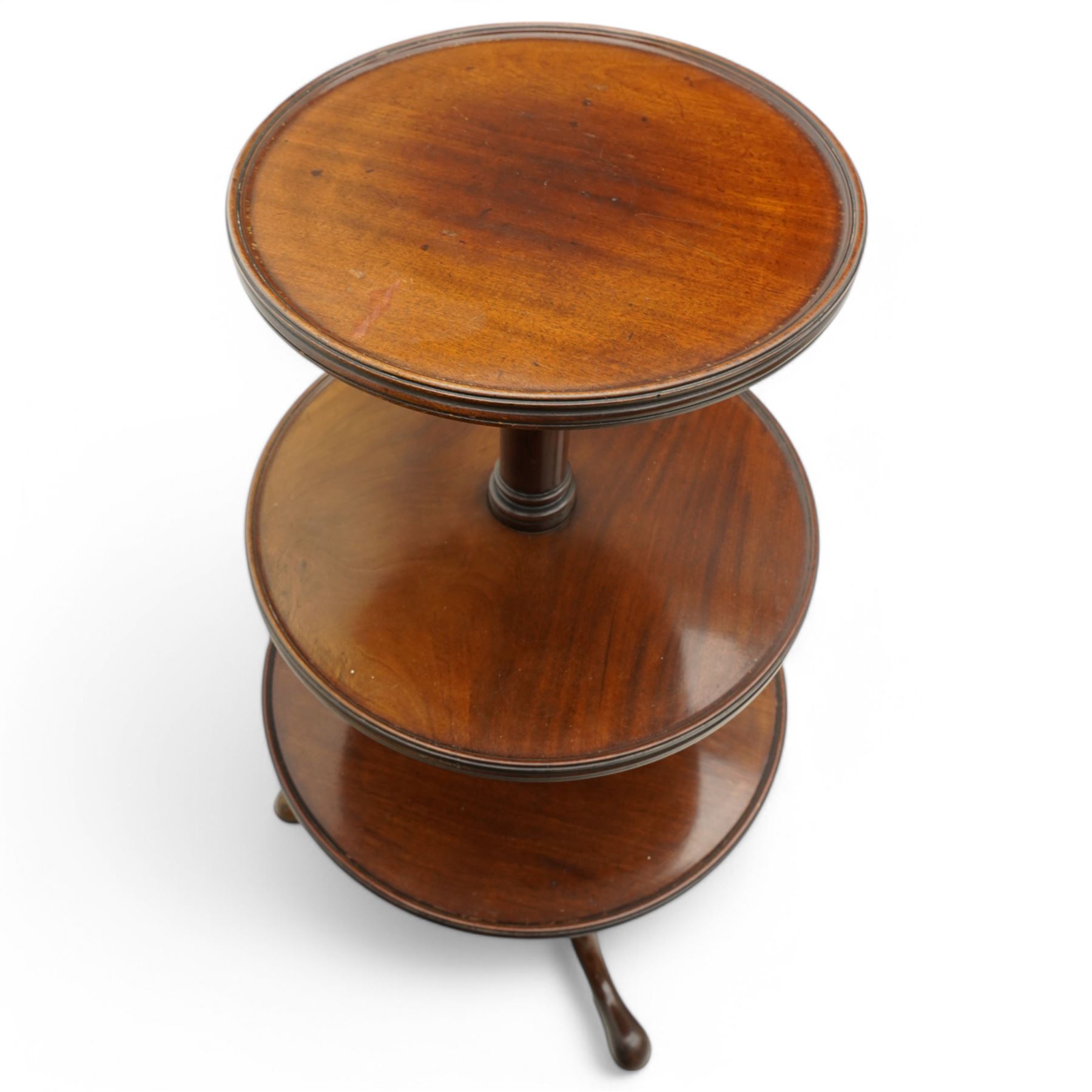 George III mahogany tripod dumb-waiter, three graduating tiers with moulded and lipped edges, on ring turned barrel pedestal supports, on three out-splayed supports 