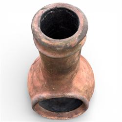 Terracotta chimney patio heater on metal stand