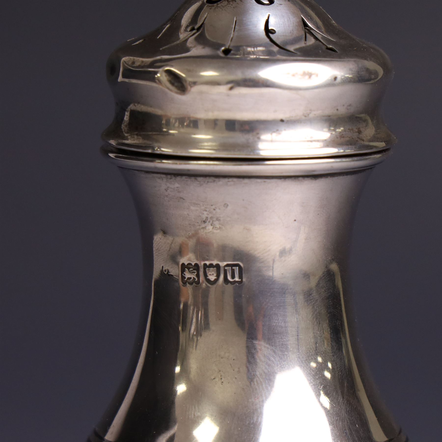 Early 20th century silver sugar caster, of typical form with removable pierced cover and upon circular foot, hallmarked Charles Edwards, London 1916, H18cm