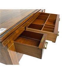 Edwardian inlaid mahogany games or work table, rectangular fold-over top inlaid with stylised dragon ivorine decoration and stringing, fitted with one long flanked by four small drawers over sewing compartment drawer, raised on square tapering supports with castors