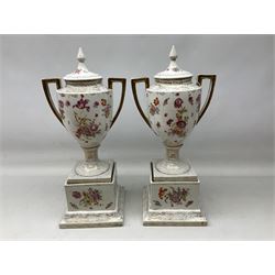 Pair of Sitzendorf twin handled covered urns, decorated with panels containing figural images in period costume, signed Bouchers, factory mark beneath, H56cm