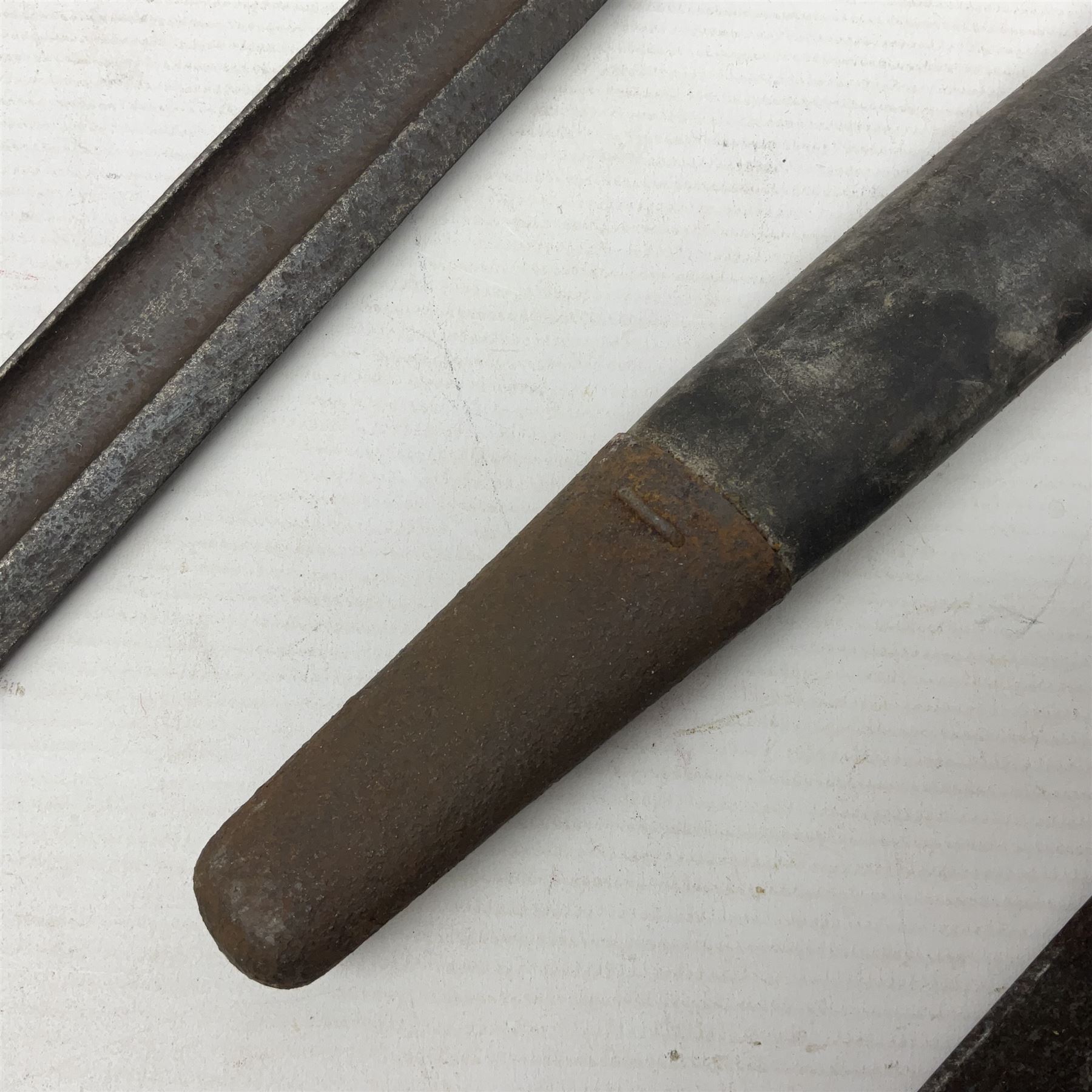 WWI Remington Pattern 1913 bayonet, the 43cm fullered blade with various marks to the ricasso including date code 11 16; in leather covered scabbard with various stamps including JWB 17 L58cm overall; and a French Model 1866 sabre bayonet (no scabbard)