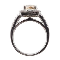 18ct white gold round brilliant cut fancy light brown diamond ring, with halo diamond surround and diamond set shoulders, stamped 750 18K, central diamond 2.00 carat, total white diamond weight 0.90ct