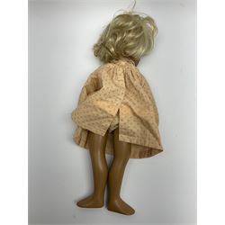 Sasha Morgenthaler vinyl doll, the girl's head with painted blue eyes and lips and short blonde hair, the jointed body donning a peach floral dress with matching underclothes, unmarked, H41cm