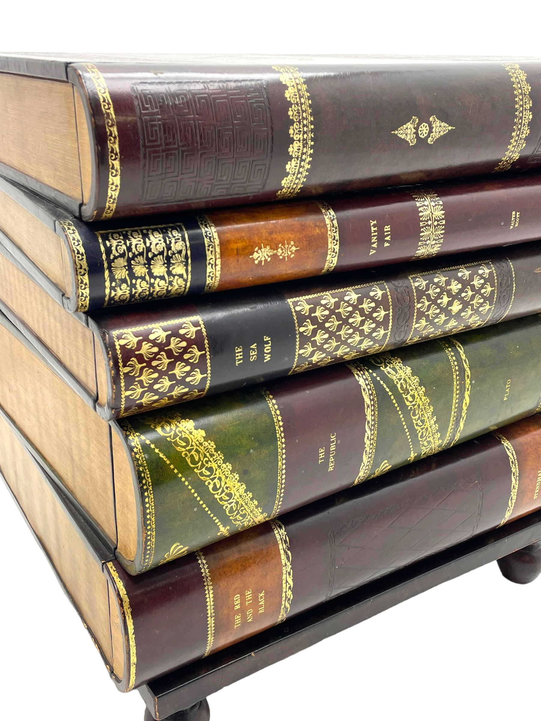 Maitland-Smith - four drawer chest in the form of a stack of leather-bound books, the top drawer with metal label inscribed 'Maitland-Smith', on turned feet