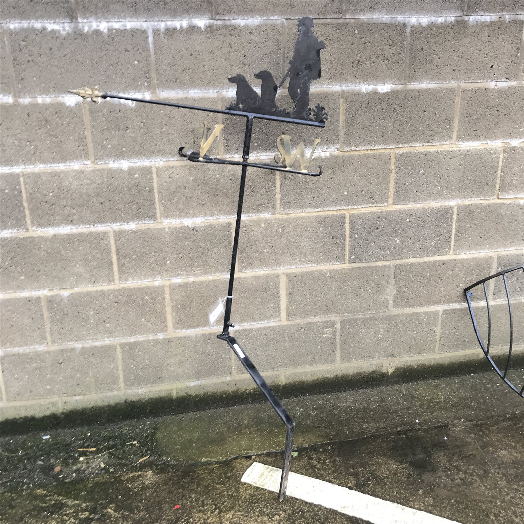 Wrought metal weather vane with hunting scene pediment, H165cm (overall) a hay rack, flower rack and two wall holders 