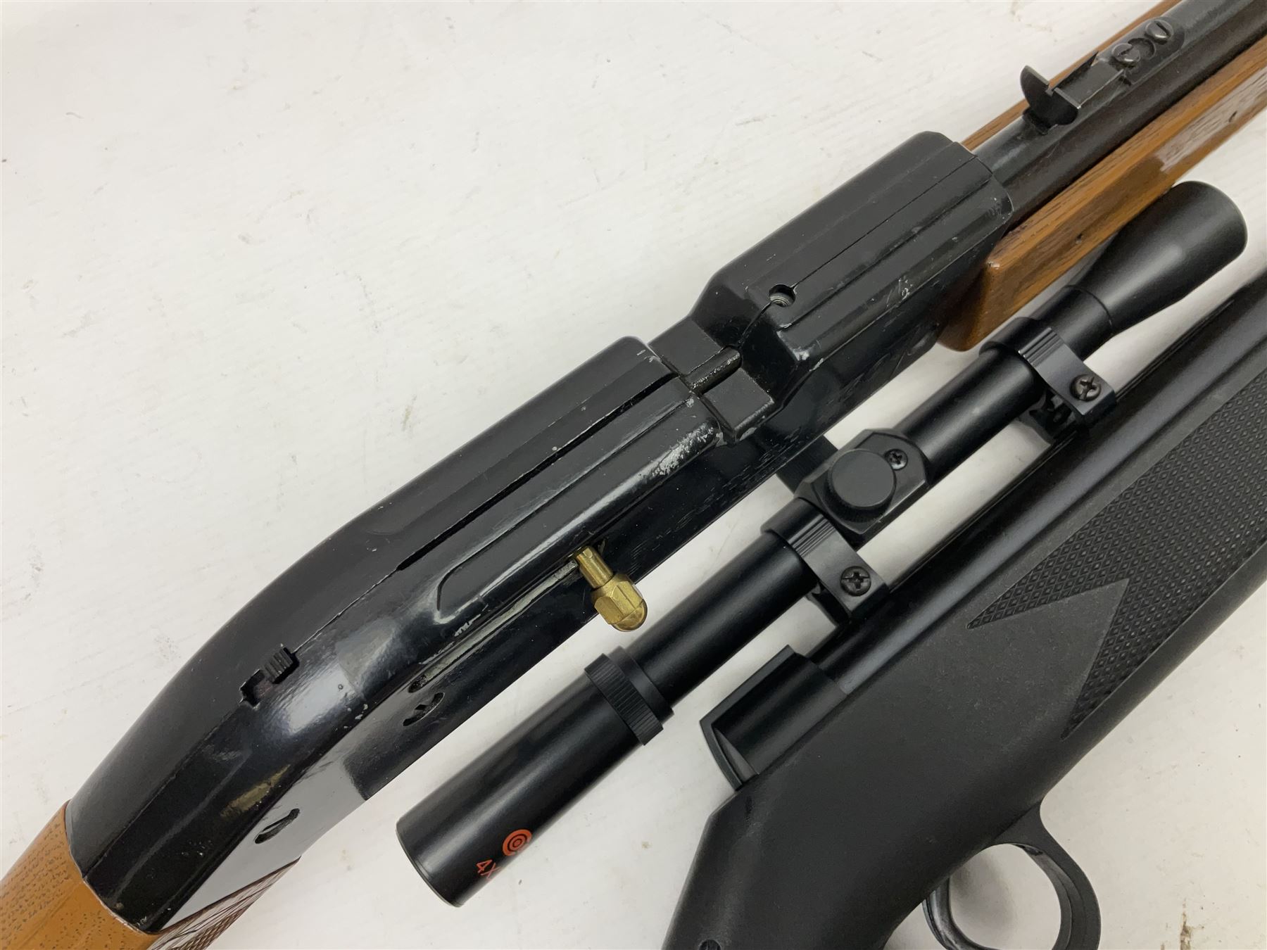 Crosman 760 .177 cal. Junior air rifle with under lever faux pump action and simulated wooden fittings; serial no.278047476, L90cm overall; and SMK B1 Synthetic .22 cal. Youth's air rifle with break-barrel action and 4 x 20 scope; serial no.1721229956084915F, L98.5cm overall (2)  NB: AGE RESTRICTIONS APPLY TO THE PURCHASE OF AIR WEAPONS.