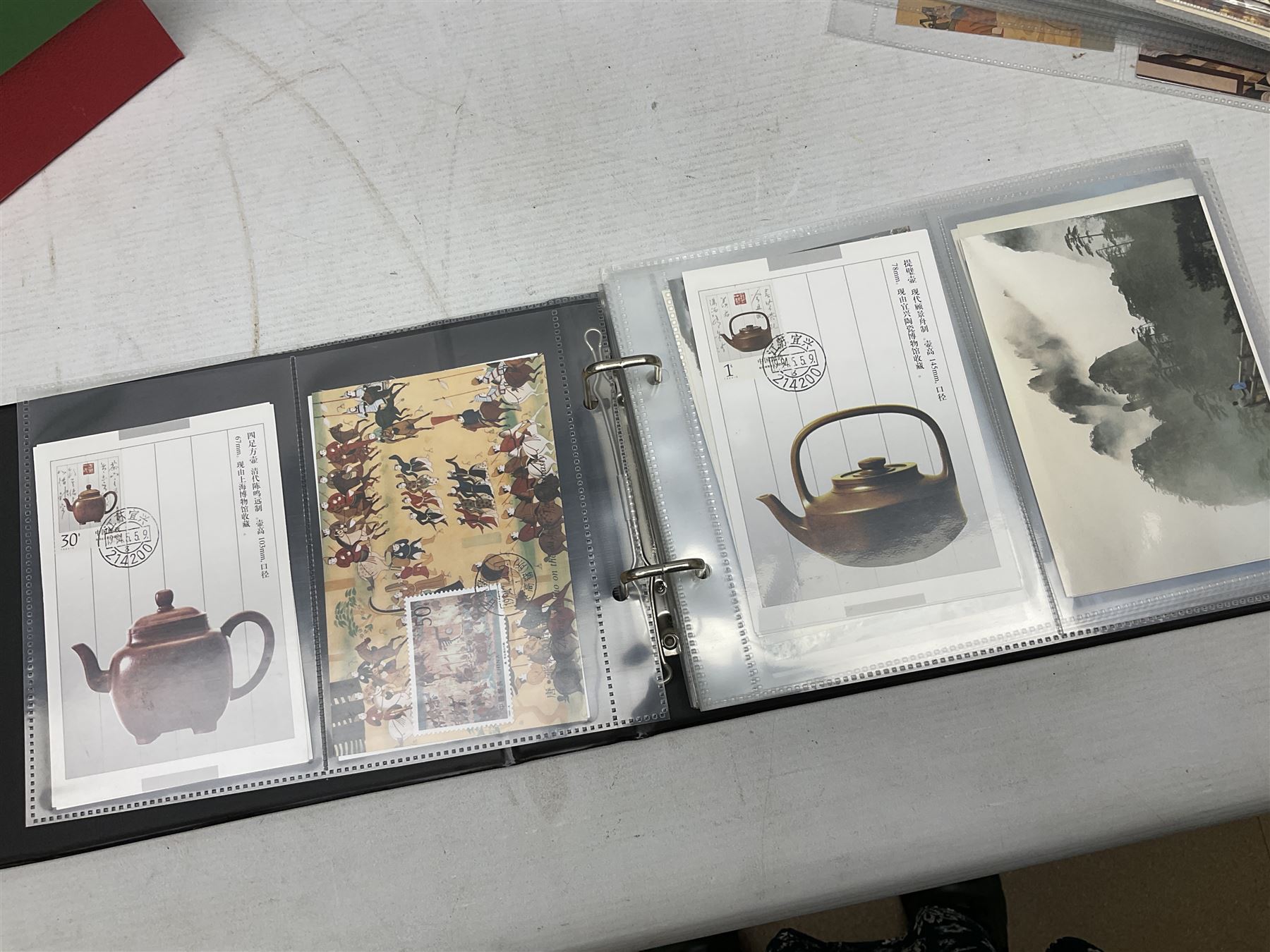 Mostly Chinese stamps including  covers and postcards, many being from the 80s and 90s, housed in ten folders