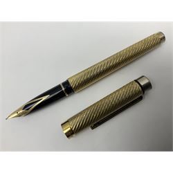 Hallmarked silver Yard-O-Led propelling pencil with engine turned decoration in original wooden box with paperwork and leather pocket sleeve; and a Sheaffer gold plated fountain pen with 14ct gold nib, box L17.5cm (2)
