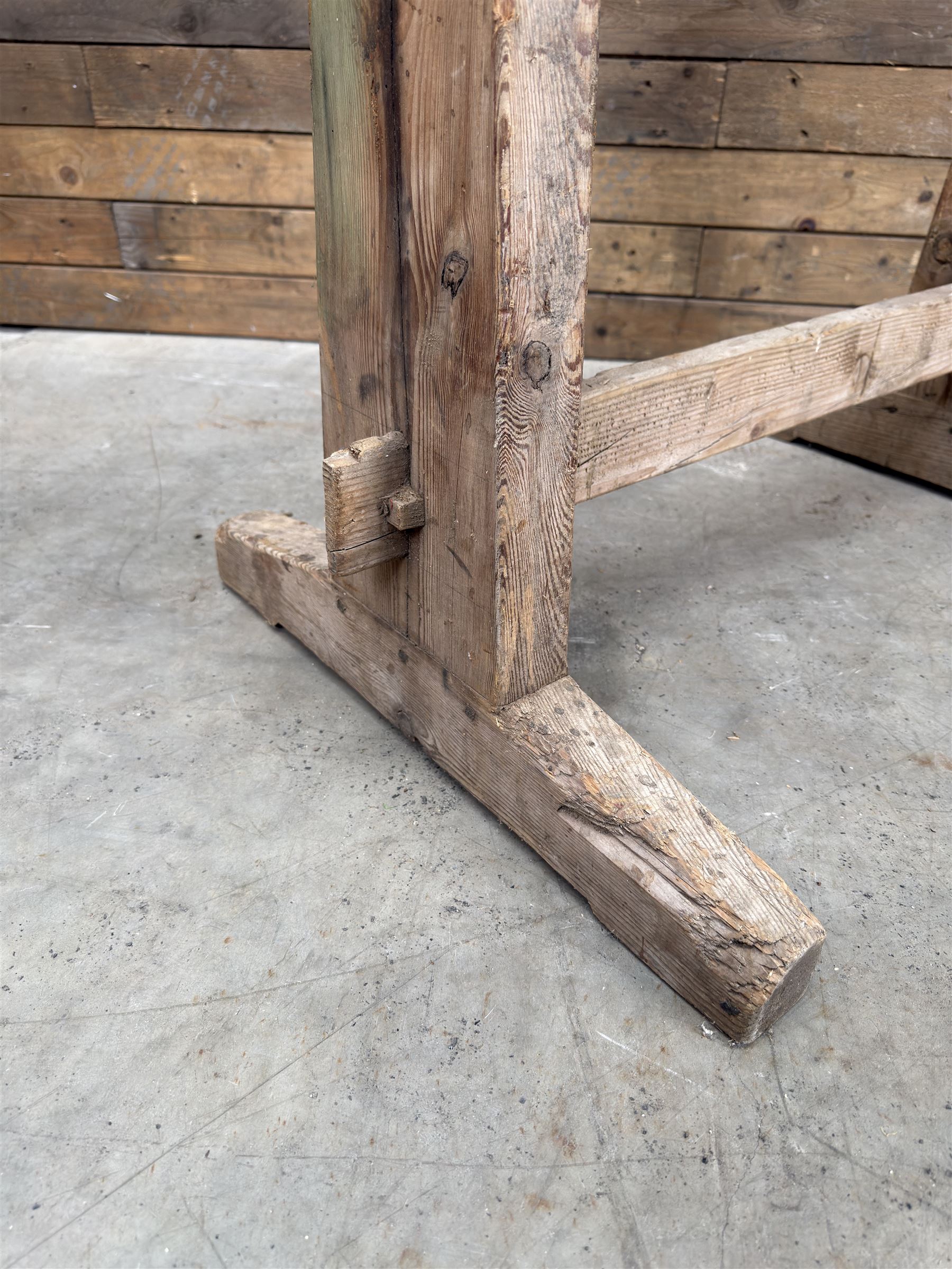 Pair of late 19th century pitch pine trestles, square tapering form in stripped finish