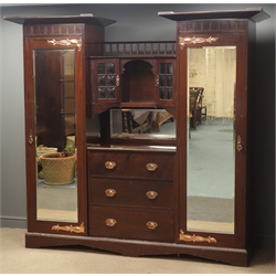  Art Nouveau mahogany triple wardrobe, projecting cornice above two full length bevel edged mirror glazed doors, interior with hanging rails and hooks, central cupboard with bullseye glazed doors, three drawers, on shaped plinth base, W221cm, H206cm, D61cm  