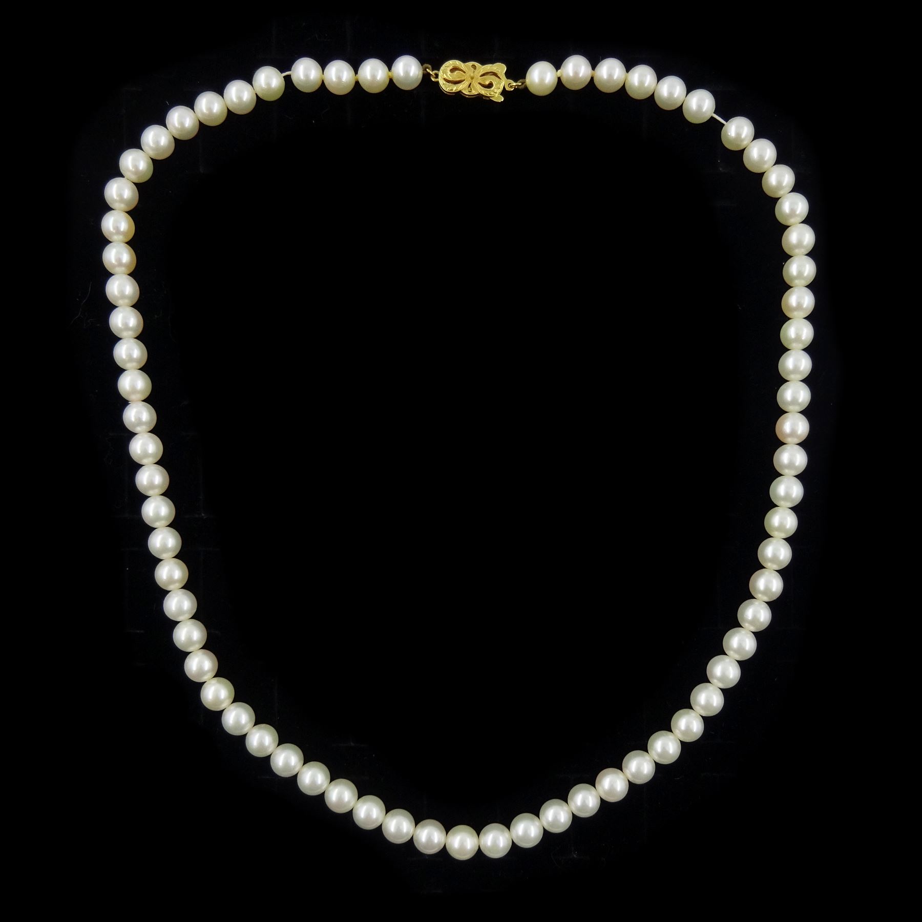 Mikimoto single strand cultured white pearl necklace, with 18ct gold clasp, stamped 750, boxed with certificate dated 1983