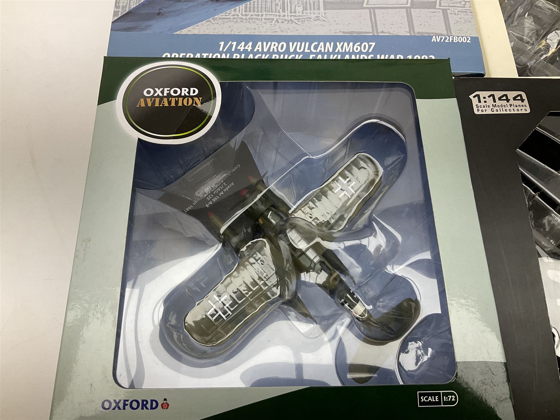 Fourteen die-cast models of aircraft including four Oxford Aviation, two Military Giants of the Sky, two Ixo Models, Corgi Warbirds Messerschmitt, Atlas Editions Spitfire and Messerschmitt, two Hobby Master etc; and two die-cast models of tanks; all boxed (16)