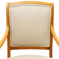 Pair of French Empire design fauteuil armchairs, high back over scrolled arm terminals, upholstered in cream fabric, on scroll carved cabriole supports