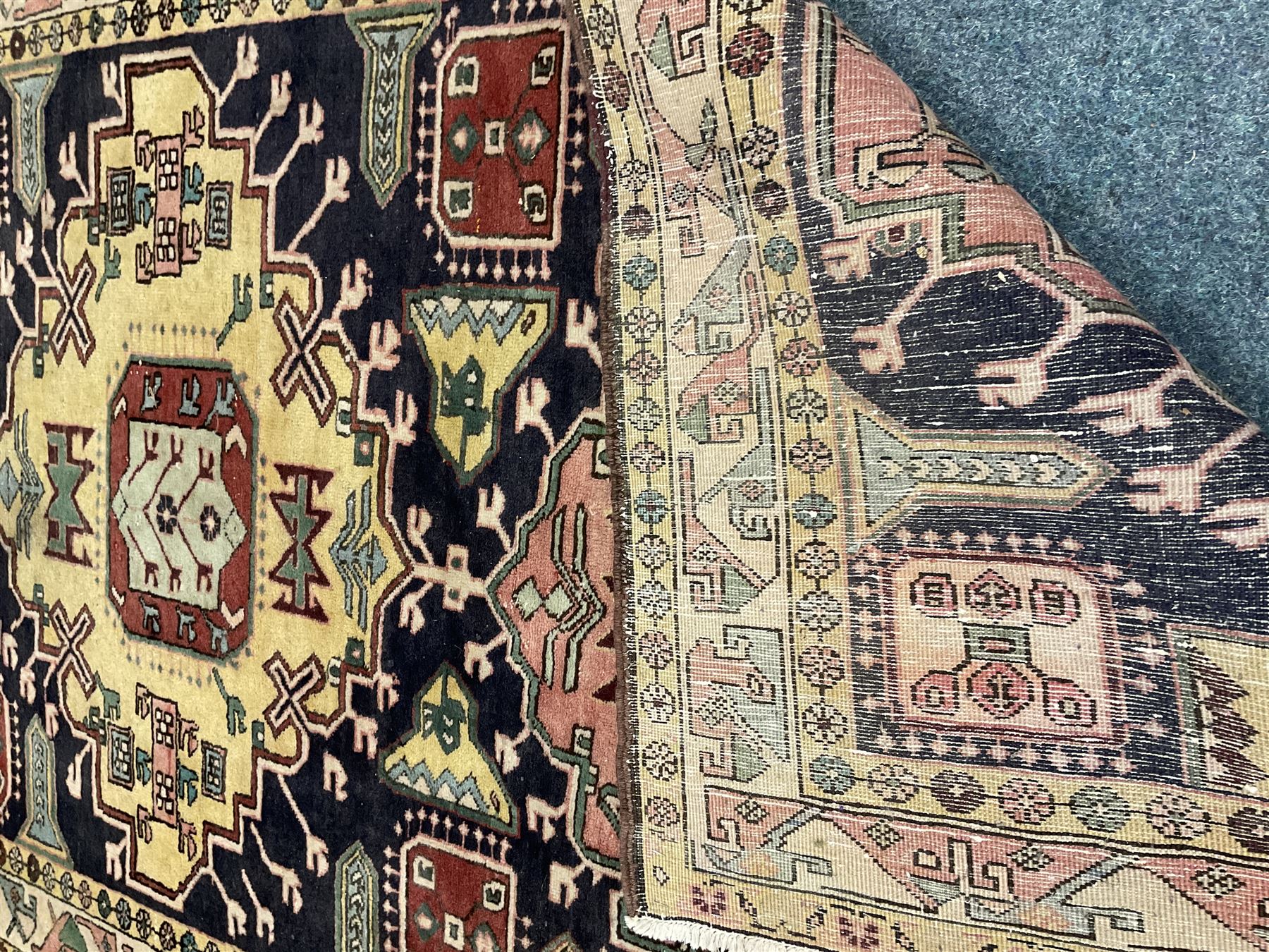 Turkish design blue and beige ground rug, triple medallion, repeating border