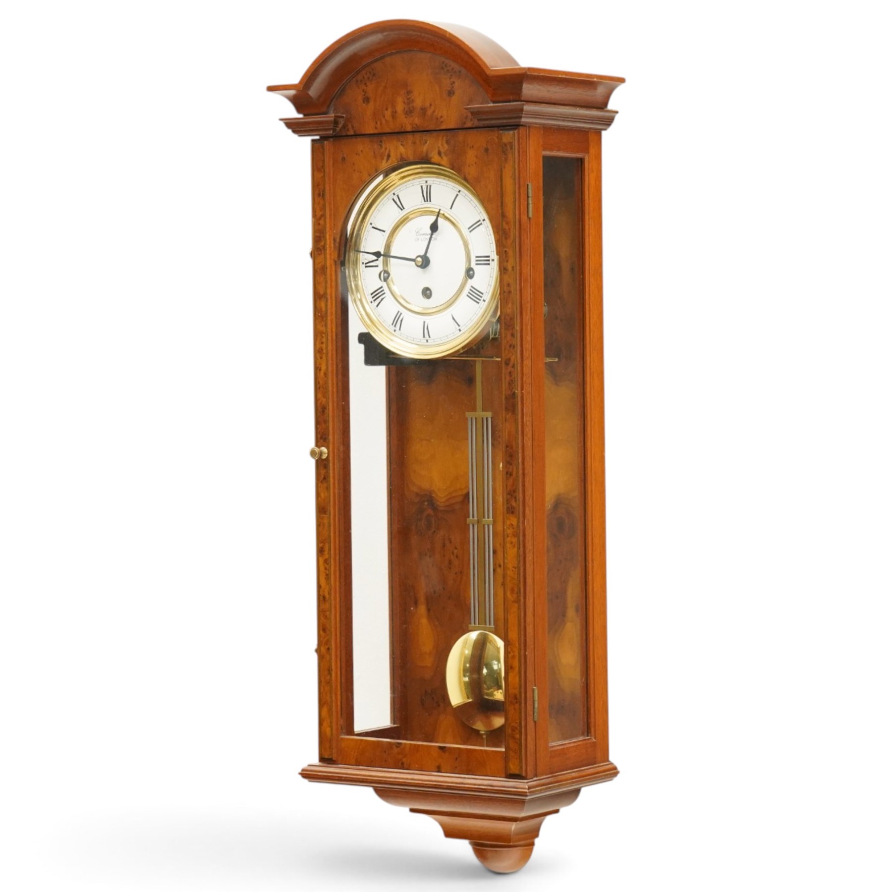 Comitti of London - burr walnut three-train wall clock, the circular dial with Roman numerals, glazed case revealing the movement and brass pendulum