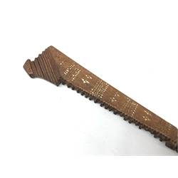  Samoan wooden club, shaped blade with serrated edge and painted geometric decoration, ribbed straw bound handle, L64cm  