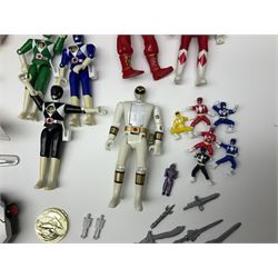 Collection of early 90s Mighty Morphin’ Power Rangers Zords, figures and accessories. Titanus the Carrier Zord, marked Bandai 1991; Green Dragonzord, incomplete; 1994 White Tigerzord with original instruction manual; 1993 Triceratops Dinozord, Mastodon Dinozord and Sabertooth Tiger Dinozord, Pterodactyl Dinozord, missing guns; with 1993 Power Morpher and original Power Coins, with further related figures, accessories and weapons