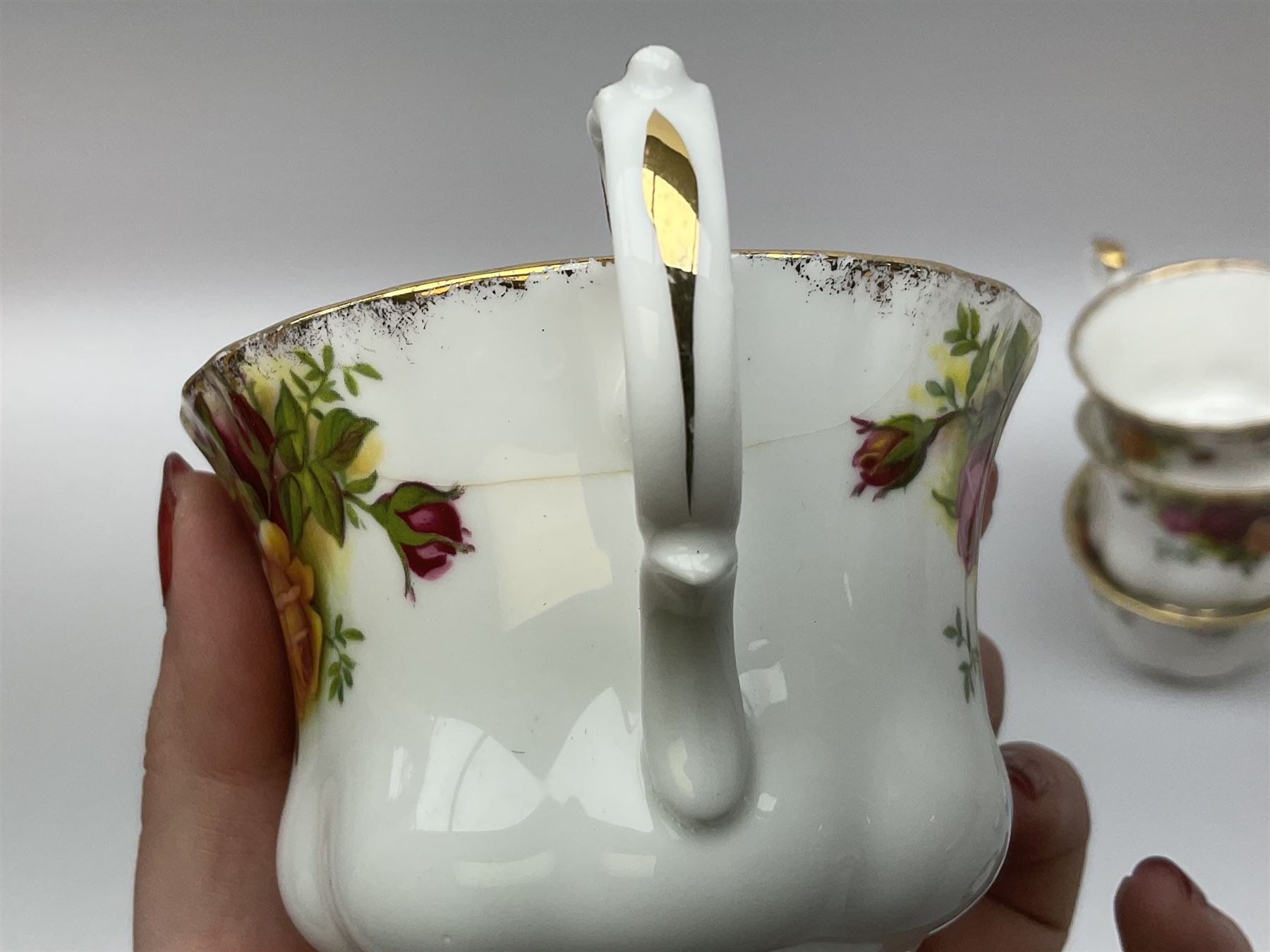 Royal Albert Old Country Roses pattern tea set, comprising teapot, coffee pot, six teacups and six saucers, five side plates, further teacup with joined saucer and side plate, open sucrier, milk jug, cake plate, and preserve pot and cover, together with Royal Albert Jubilee Rose pattern sauce boat and stand, and Royal Albert Lavender Rose pattern cake stand. 