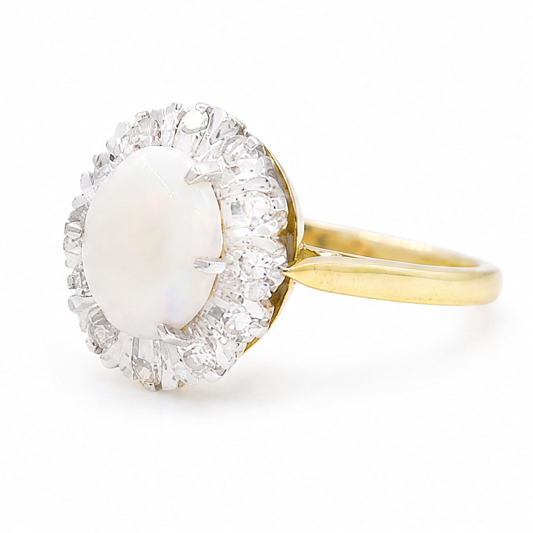 18ct gold opal and diamond cluster ring, oval cabochon cut opal surrounded by twelve single cut diamonds, London 1988