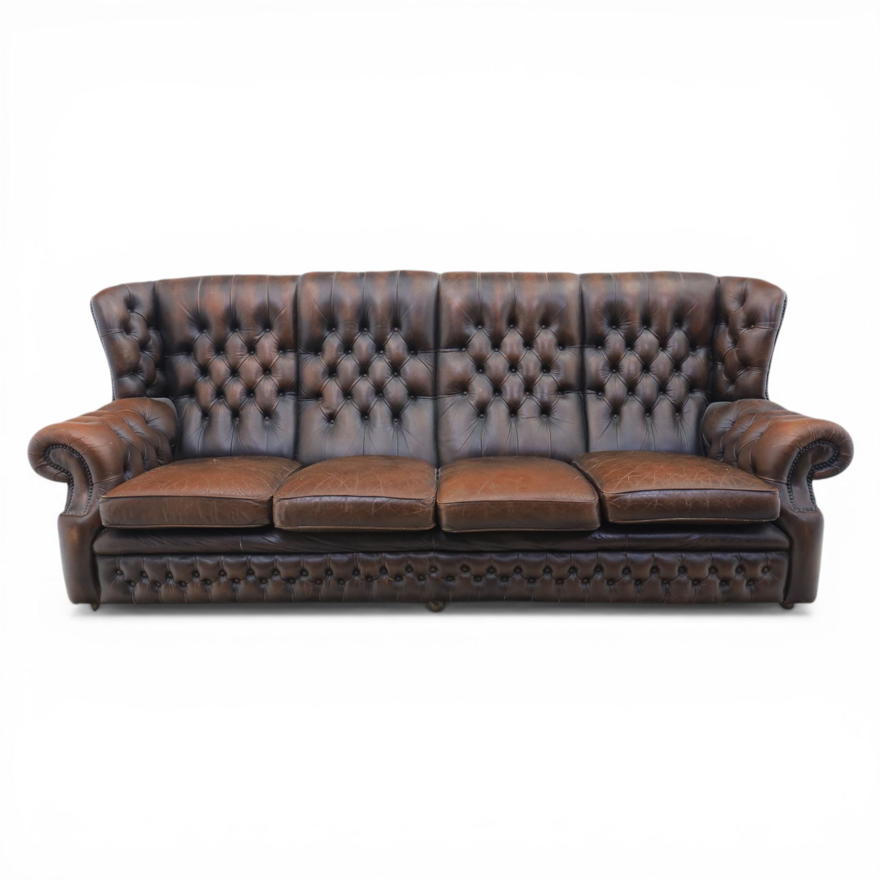 Georgian design Chesterfield lounge suite, comprising highbacked four seat sofa and pair armchairs, upholstered in chocolate brown leather, Armchairs (H 90cm, W 91cm) Sofa (H 91cm, W 238cm)