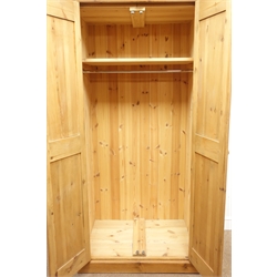Solid pine double wardrobe enclosed by two panelled doors, W98cm, H197cm, D67cm