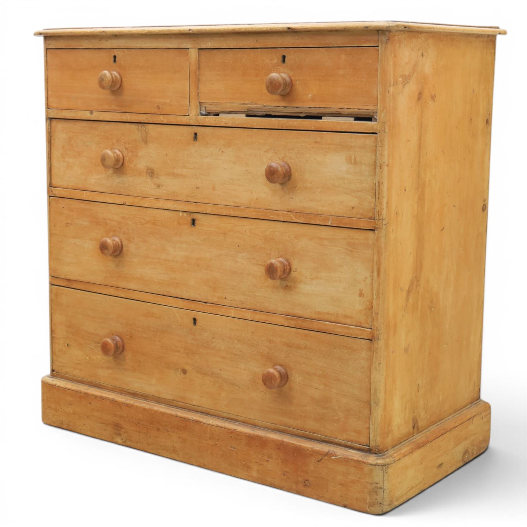 Victorian waxed pine chest, fitted with two short and three long drawers, turned wooden handles, raised on plinth base
