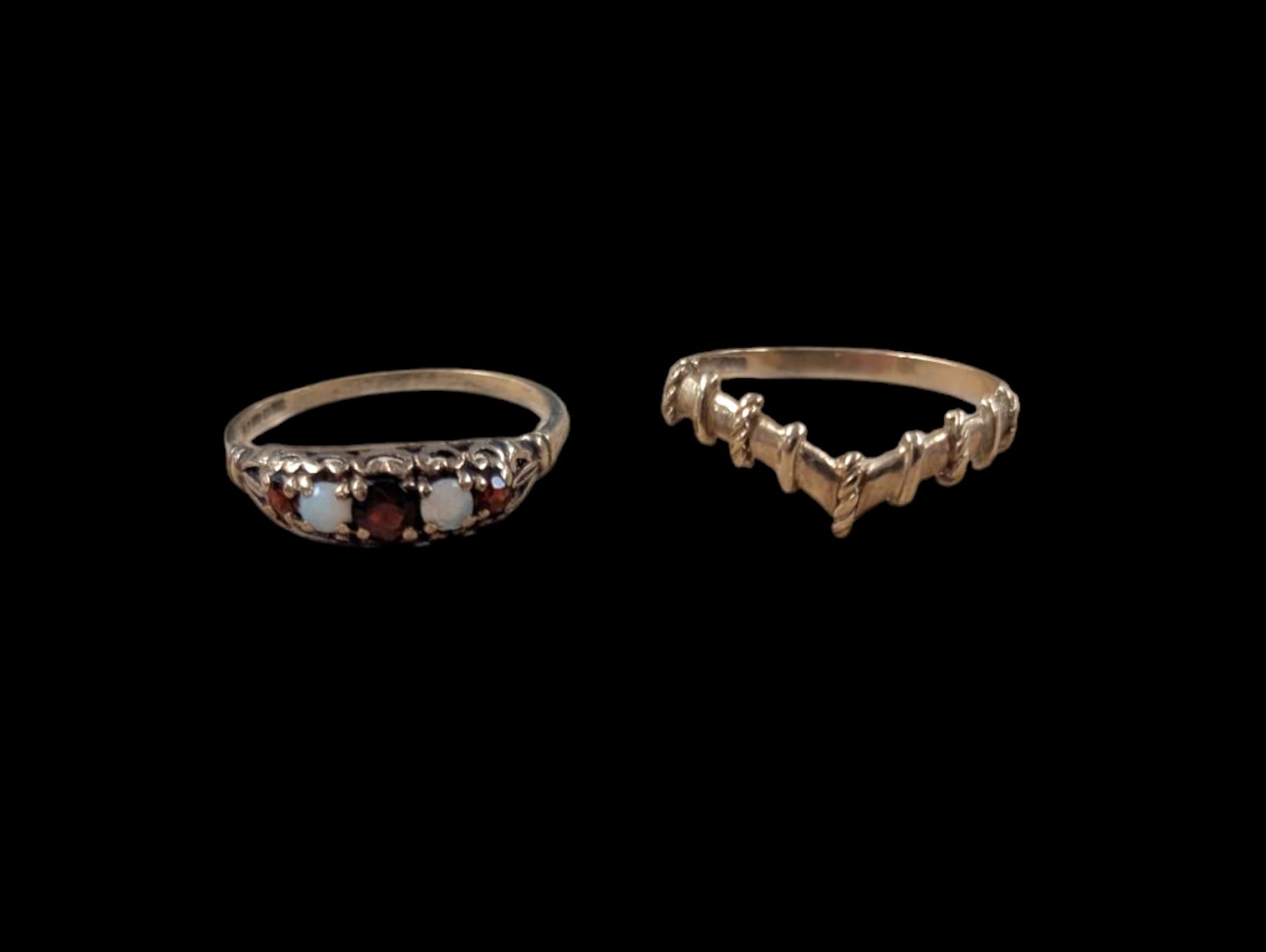 Two 9ct gold rings, comprising wishbone ring and five stone opal and garnet ring, both hallmarked