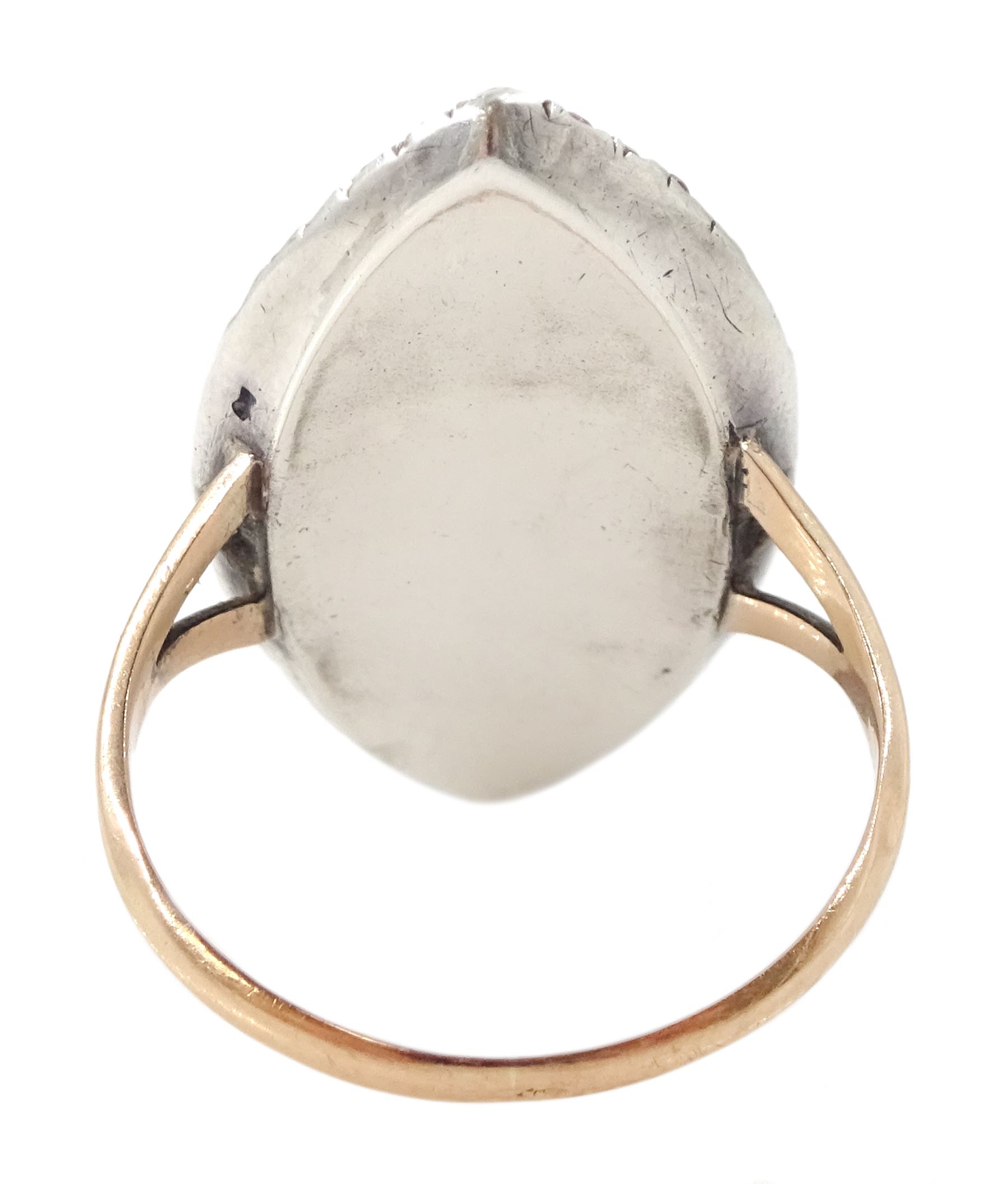 18th / 19th century gold and silver paste stone set portrait ring, the navette bezel set with a miniature of a woman on ivory, under a glazed panel, within a pink paste border and trifurcated shoulders. This lot has been registered for sale under Section 10 of the APHA Ivory Act