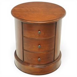 Willis & Gambier - circular chest, three drawers with brass pulls on a moulded 
