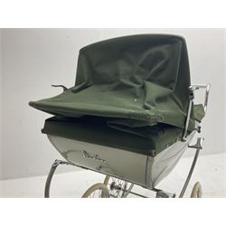 Silver Cross coach-built doll's pram with green fold-down hood and cover, sprung tubular frame, chrome and white handle, four spoked wheels with brake, mattress, pillow and bedding L97cm