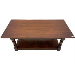 Rectangular medium oak coffee table, turned supports joined by undertier 