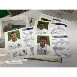 Collection of approximately 200 Leeds United related autographs, predominantly signed newspaper cuttings, contained within ring binder, together with a number of loose examples