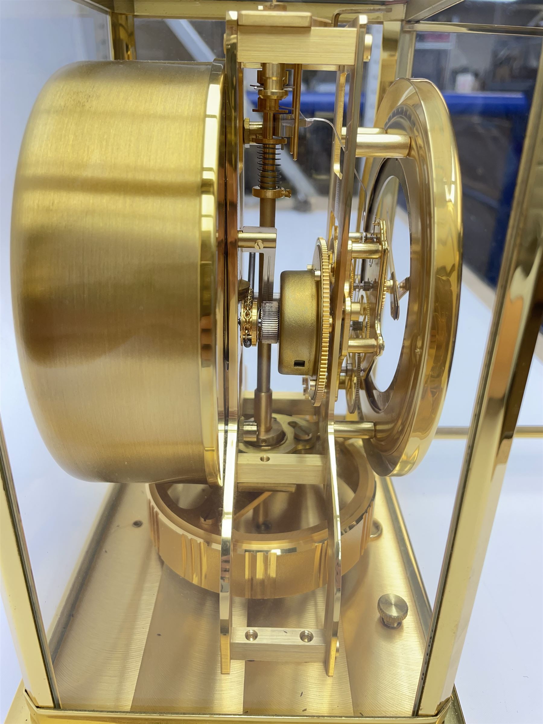Jaeger-LeCoultre Atmos timepiece clock, in gilt brass and glass case, with wall mount, serial number - 444966