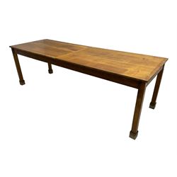 Early 20th century oak dining table, rectangular top raised on square supports 