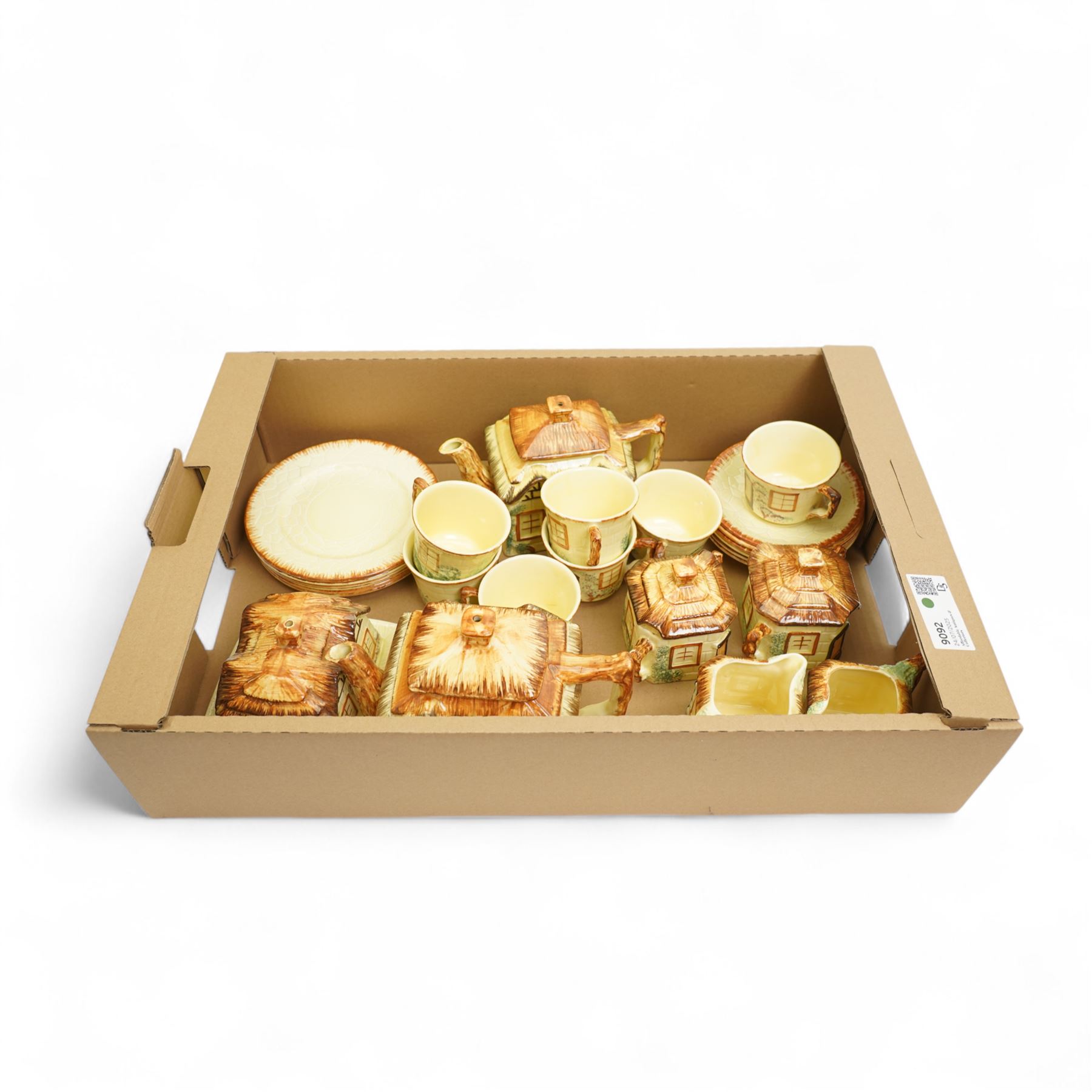 Keele St. Pottery cottage tea set comprising seven cups, six saucers, six plates, large and small teapots, butter dish, two milk jugs and two sugar bowls and covers