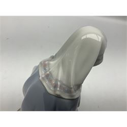 Lladro figure, Holy Night, modelled as Mary kneeling over baby Jesus, sculpted by Vincente Martinez, with original box, no 5796, year issued 1991, year retired 1994, H22cm