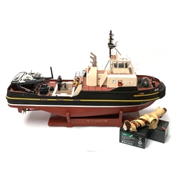 24-Volt radio controlled model of the American tug boat 'Jo-Jo' with full range of deck fittings, two batteries, transmitter, remote control, receivers and two launching straps, displayed on wooden stand L103cm
