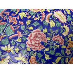 18th/19th century Chinese Canton enamel basin, the circular basin with flat everted rim, decorated with scrolling foliate and fruit decoration on a blue ground, D43cm