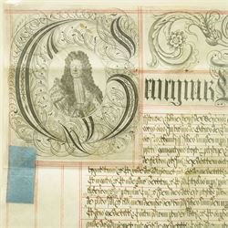 George I indenture on vellum in black ink with ornate headline and engraved portrait of George I, framed 85cm x 95cm overall