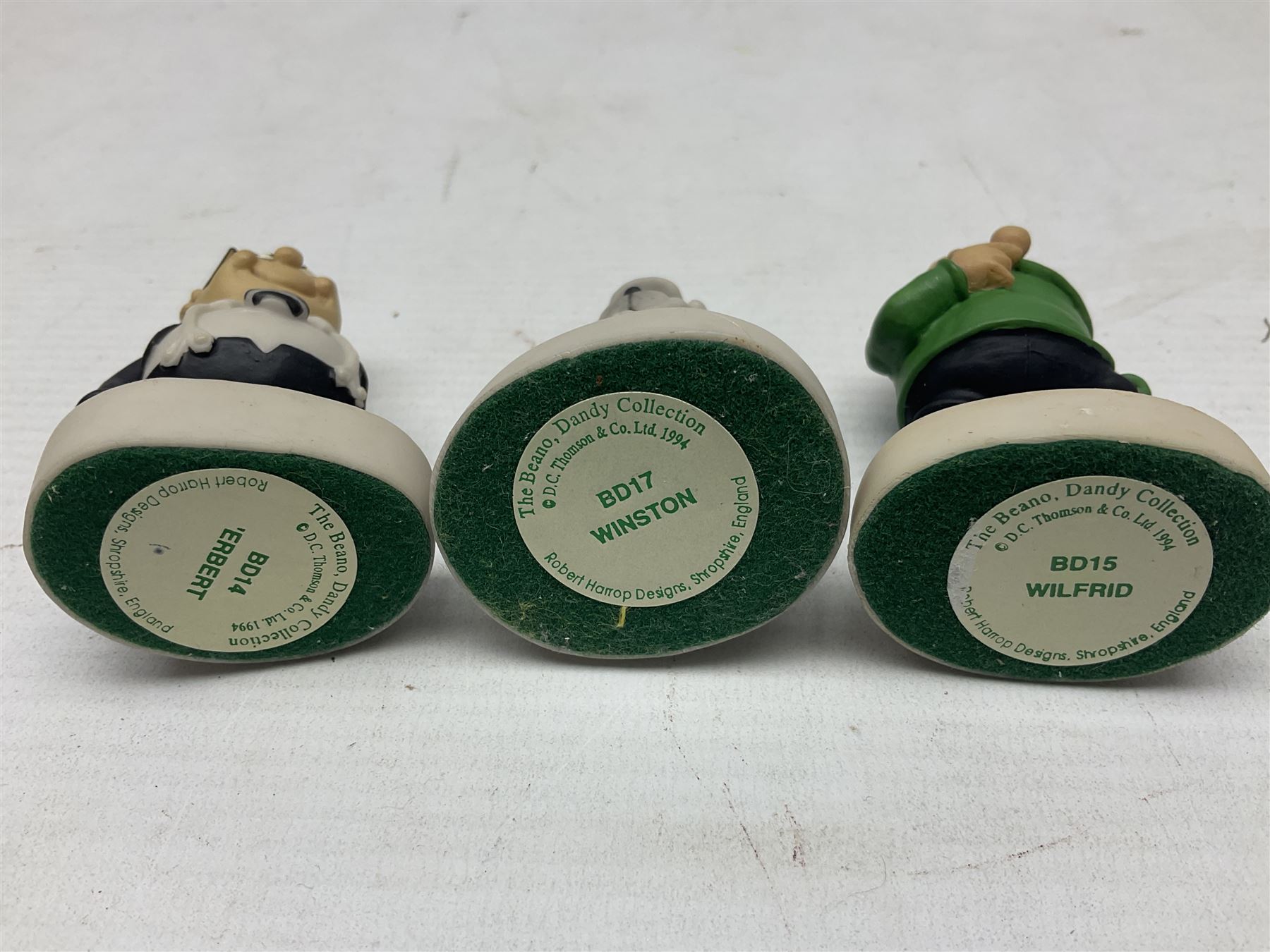 Thirteen Robert Harrop figures from the Beano Dandy collection, comprising Yo-Yo Collectors Piece 1996, Desperate Dan BD03, Cuthbert Cringeworthy BD08, Teach BD06, 'Erbert BD14, Toots BD12, Winston BD17, Fatty BD07, Dennis The Menace BD01, Dennis the Menace Fishing BD806, Sydney BD13, Wilfrid BD15 and Plug BD11