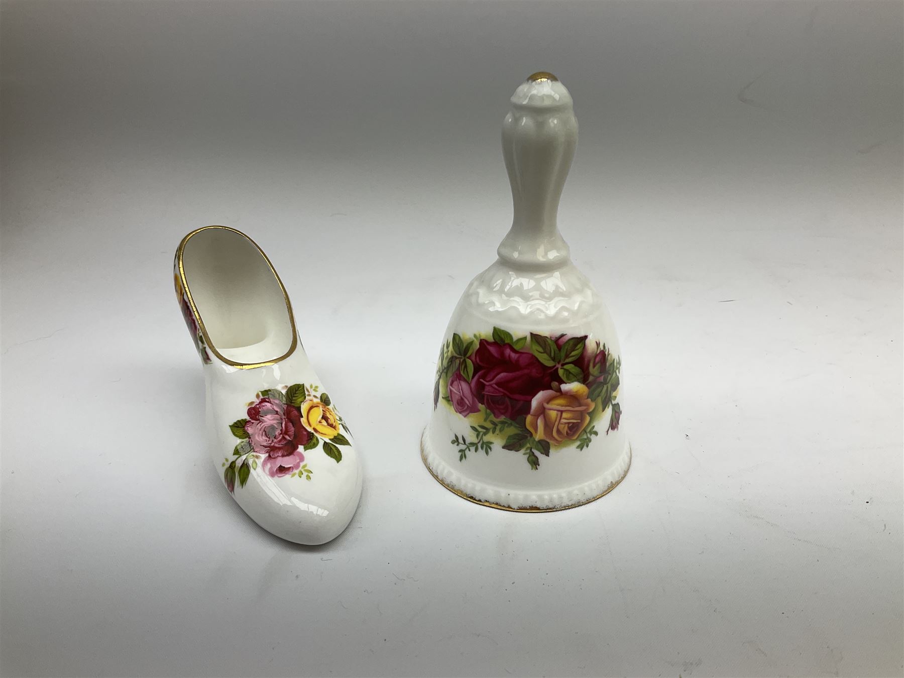 Royal Albert Old Country Roses part dinner and tea service comprising teapot, four tea cups and saucers, eight dessert plates, cake plate, cake stand, a tureen with cover, six dinner plates, an oval dish, two trinket dishes, bell and shoe decoration. 