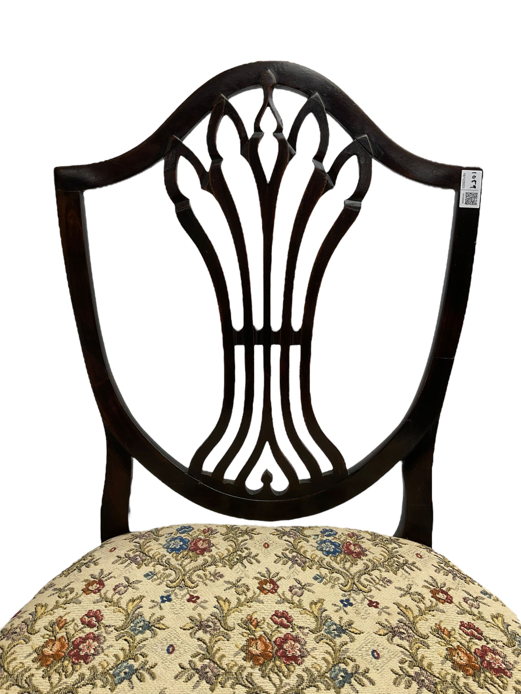 Early 19th century elm side chair, shaped cresting rail over vasiform splat with pierced decoration (W53cm, H96cm); Hepplewhite period mahogany side chair, shield back with pierced splat, on square tapering supports with spade feet (W55cm, H99cm); George III walnut elbow chair, shaped cresting rail and moulded frame, upholstered drop-in seat, on square supports with inner chamfer (W59cm, H95cm) (3)