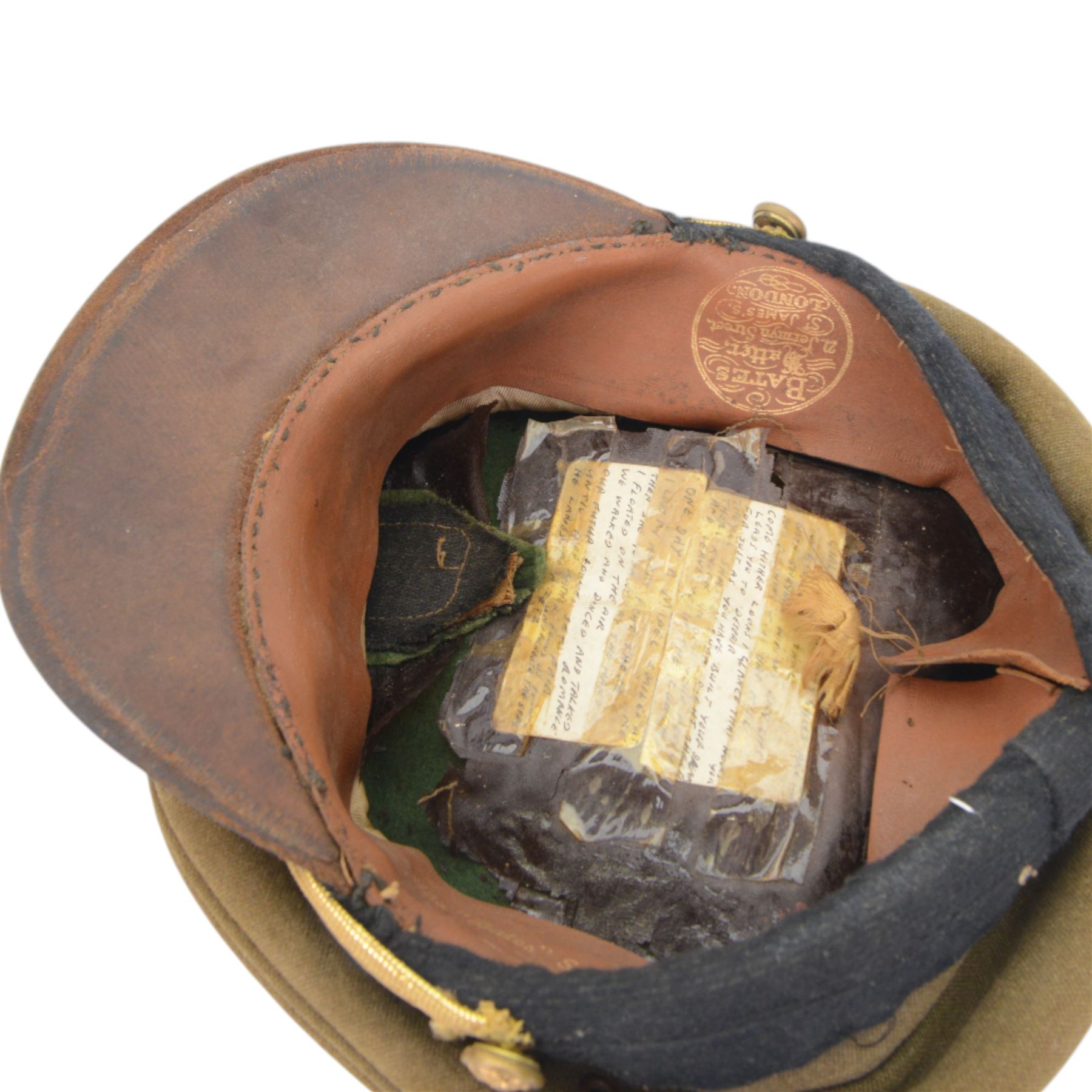 Bates service cap with hand written poem inside, together with Officer's Sam Browne brown leather belt, pistol holder and sword frog