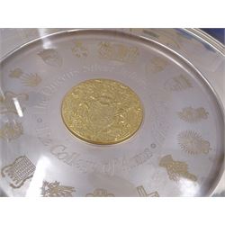 Modern limited edition silver The College of Arms plate to commemorate the The Queen's Silver Jubilee, the plain circular plate with central 24ct gold plated plaque depicting the Royal Arms, bordered by engravings of The College of Arms and the Kings Arms etc, by Danbury Mint, hallmarked Yorkshire Mint, Birmingham 1977, number 350/2500, in original fitted box with paperwork, D26,5cm, 