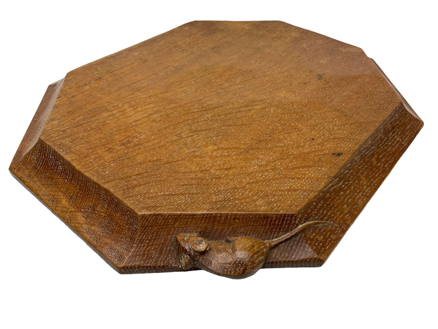 Mouseman - adzed oak breadboard, canted rectangular form with moulded edge carved with mouse signature, by the workshop of Robert Thompson, Kilburn, W31cm D26cm
