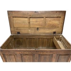 Georgian oak mule chest, moulded rectangular hinged lid over quadruple fielded panel front, the frieze inscribed '17 A Y 57', fitted with two drawers, panelled ends and back, on stile supports