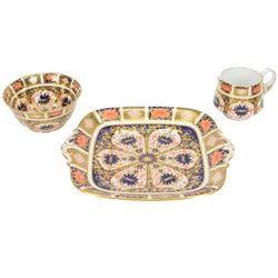 Royal Crown Derby tea service for six in Imari 1128 pattern, comprising teacups and saucers, side plates, sandwich plate, milk jug, open sucrier and cake slice 